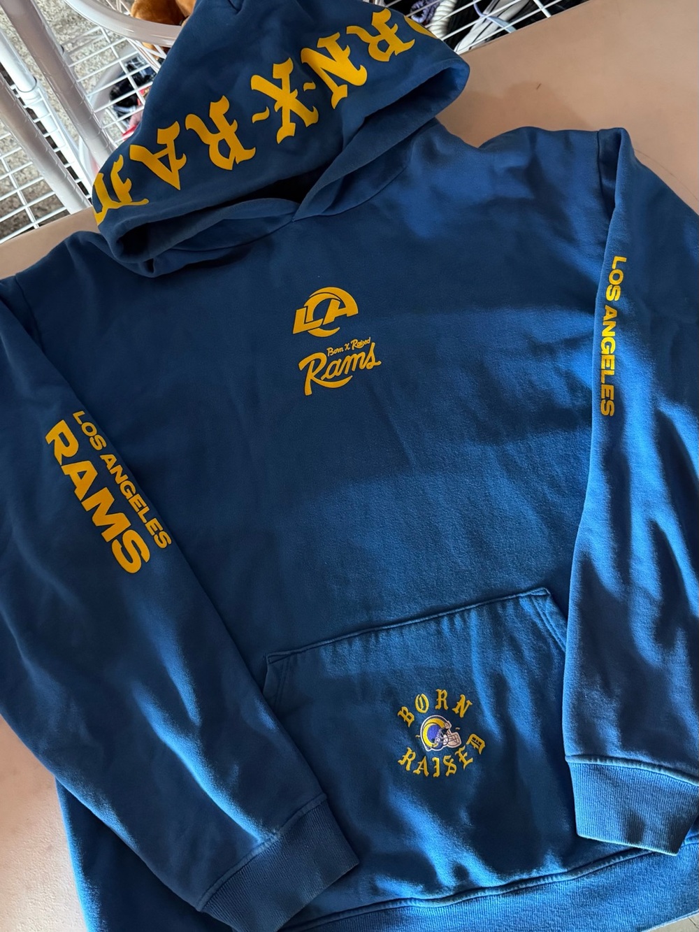BORN X RAISED Los Angeles Rams Blue & Gold Hoodie - Team Logo